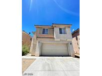 Two-story home featuring a spacious two-car garage and stucco exterior at 5213 Castle Butte Ct, North Las Vegas, NV 89031