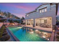 Inviting backyard with a private pool, spa, and covered patio perfect for outdoor entertaining and relaxation at 541 Green Sage Way, Las Vegas, NV 89138