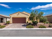 Charming single-story home featuring a well-maintained front yard and a two-car garage with brick-paved driveway at 5524 E San Pietro Dr, Pahrump, NV 89061