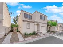 Charming two-story home with a stucco exterior, a small front yard, and an attached one car garage at 9926 Swimming Hole St, Las Vegas, NV 89183