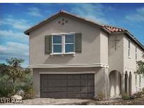 Charming two-story home with a traditional design, attached garage, and beautiful architectural details at 10032 Indy Rey Ct, Las Vegas, NV 89148