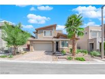 Charming two-story home featuring desert landscaping, stone accents and brick driveway at 10254 Kesington Dr, Las Vegas, NV 89135