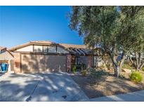 Charming single-story home featuring a two-car garage and mature landscaping at 146 Cascade Dr, Henderson, NV 89074