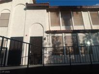 Inviting two-story condo with secure gated entries and charming architectural details at 2080 Karen Ave # B-41, Las Vegas, NV 89169