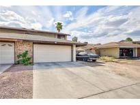 Charming two-story townhome with a two-car garage and desert landscaping at 3939 Jontue St, Las Vegas, NV 89115