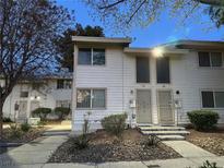 Charming townhouse featuring a well maintained lawn and inviting front entrances at 4770 Topaz St # 73, Las Vegas, NV 89121