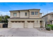 Charming two-story home featuring a three-car garage and well-maintained front yard at 5588 Holcomb Bridge Ct, Las Vegas, NV 89149