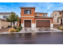 Charming two-story home featuring a two car garage and beautiful desert landscaping at 817 Great Sky Ct, North Las Vegas, NV 89084