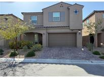 Charming two-story home features a landscaped front yard and a convenient two-car garage at 8675 Principato St, Las Vegas, NV 89166