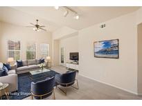 Bright living room featuring a comfortable seating area, modern decor, and ample natural light at 10550 W Alexander Rd # 2017, Las Vegas, NV 89129