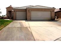 Two car garage and desert landscaping enhance this attractive single-story home at 1160 Golf Club, Laughlin, NV 89029