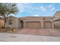 Charming single-story home featuring a three-car garage and low-maintenance desert landscaping at 1273 Olivia Parkway Pkwy, Henderson, NV 89011
