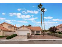 Charming single-story home showcasing a well-maintained front yard, desert landscaping, and a two-car garage at 1335 Heather Oaks Way, North Las Vegas, NV 89031
