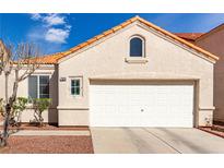 Inviting single-story home featuring a two-car garage and desert landscaping at 7628 Picnic St, Las Vegas, NV 89131