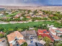 Expansive aerial view showcases the golf course community and nearby mountains at 8 Rue Du Ville Way, Henderson, NV 89011