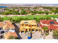 Stunning new construction home with a golf course view, tile roof, and solar panels in a beautiful community at 8 Rue Du Ville Way, Henderson, NV 89011
