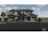 Two-story home featuring a stone-accented facade, tile roof, and a three-car garage, showcasing modern design and desert landscaping at 8 Rue Du Ville Way, Henderson, NV 89011
