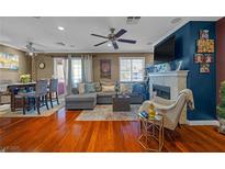 Inviting living room features hardwood floors, fireplace, ceiling fan and comfortable seating at 8600 W Charleston Blvd # 2078, Las Vegas, NV 89117
