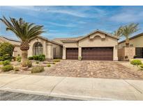 Charming home featuring a paver driveway and mature landscaping at 1342 Calle Calma, Henderson, NV 89012