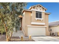 Charming two-story home featuring a two-car garage and landscaped front yard at 1922 Pyle, Las Vegas, NV 89183