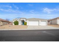 Charming single-story home with a three-car garage and low maintenance desert landscaping at 3491 Cottage Thistle Dr, Laughlin, NV 89029