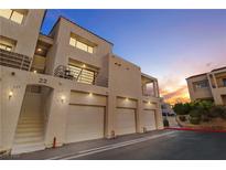 Inviting condo featuring private garage, charming balcony, and stucco facade at 3843 Desert Marina Dr # 232, Laughlin, NV 89029