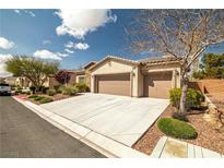 Inviting single-story home featuring a well-manicured lawn, desert landscaping, and a spacious three-car garage at 5224 E San Palo Dr, Pahrump, NV 89061