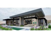 Stunning modern home with a refreshing pool and an open-concept design at 563 Rock Peak Dr, Henderson, NV 89012