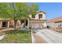 Charming two-story home with a well-maintained lawn and a spacious two-car garage at 9595 Lavarun Ct, Las Vegas, NV 89123