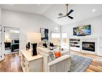 Inviting living room featuring a modern fireplace, ceiling fan, and stylish decor at 228 Mchenry St, Las Vegas, NV 89144