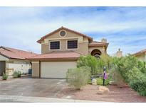 Charming two-story home featuring a red tile roof and well-maintained landscaping at 4808 Fiesta Lakes St, Las Vegas, NV 89130