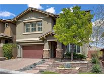 Charming two-story home featuring a two-car garage, landscaped yard, and welcoming entryway at 5742 Shadow Bend Dr, Las Vegas, NV 89135