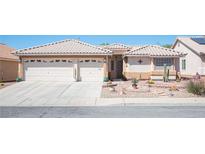 Charming single-story home with a two-car garage and desert landscaping at 1072 Pennyfeather Rd, Henderson, NV 89015