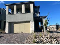 Two-story home with a two-car garage, porch, and balcony on a sunny day at 12434 Parkscene Pl, Las Vegas, NV 89138