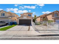 Charming two-story home with a two-car garage, low maintenance front yard, and desert landscaping at 2211 Arborwood Way, Las Vegas, NV 89142