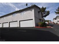 Spacious townhouse with attached garages and well-maintained landscaping at 2431 Old Forge Ln # 101, Las Vegas, NV 89121