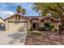 Charming single-story home with a well-manicured yard, desert landscaping, and a two-car garage at 2842 Mahogany Grove Ave, Henderson, NV 89074