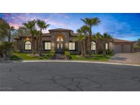 Charming single-story home with lush landscaping and a beautiful stone facade at 7687 W Pebble Rd, Las Vegas, NV 89113