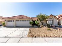 Charming single-story home featuring a three car garage and desert landscaping at 1185 Ponce De Leon Ave, Las Vegas, NV 89123