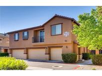 Charming townhouse featuring a private balcony and three garage spaces at 9115 Canoga Canyon Ct # 102, Las Vegas, NV 89149