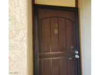 Metal security screen door with door number 45 and doorbell on a light beige stucco building at 3168 S Eastern Ave # 45, Las Vegas, NV 89169