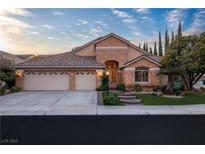Charming single-story home featuring a three-car garage, manicured landscaping, and a welcoming entrance at 1501 Via Salaria Ct, Henderson, NV 89052