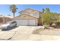 Charming two-story home with a two-car garage and desert landscaping at 169 Lovett Rd, Henderson, NV 89015