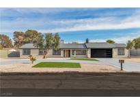 Charming single story home featuring a well-manicured front yard, gravel landscaping, and a spacious driveway at 2749 Horseshoe Dr, Las Vegas, NV 89120