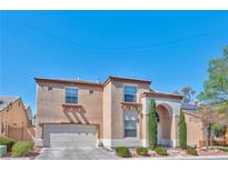Charming two-story home with a two-car garage and well-maintained landscaping at 3525 Dover Bay St, Las Vegas, NV 89129