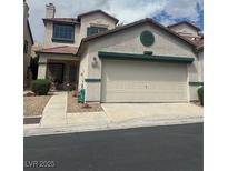 Two-story home with stucco exterior, red tile roof, and two-car garage at 4017 Radbourne Ave, Las Vegas, NV 89121