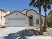Charming single-story home featuring a two-car garage and desert landscaping at 5240 Sweet William St, North Las Vegas, NV 89081