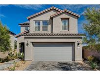 Charming two-story home with a two-car garage and well-maintained landscaping at 10004 Pasque Flower Ct, Las Vegas, NV 89178