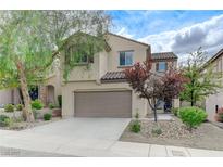 Charming two-story home featuring a well-maintained yard and a two-car garage at 2617 Romarin Ter, Henderson, NV 89044