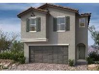 Two-story home featuring stone accents, a front-entry garage, and a welcoming covered porch at 9070 Rivington Ave, Las Vegas, NV 89148